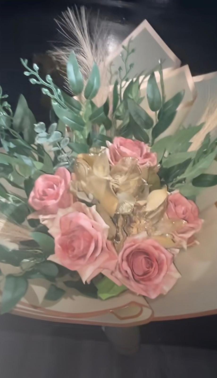 Pink roses with gilded gold roses, eucalyptus and pampas in cream wrap